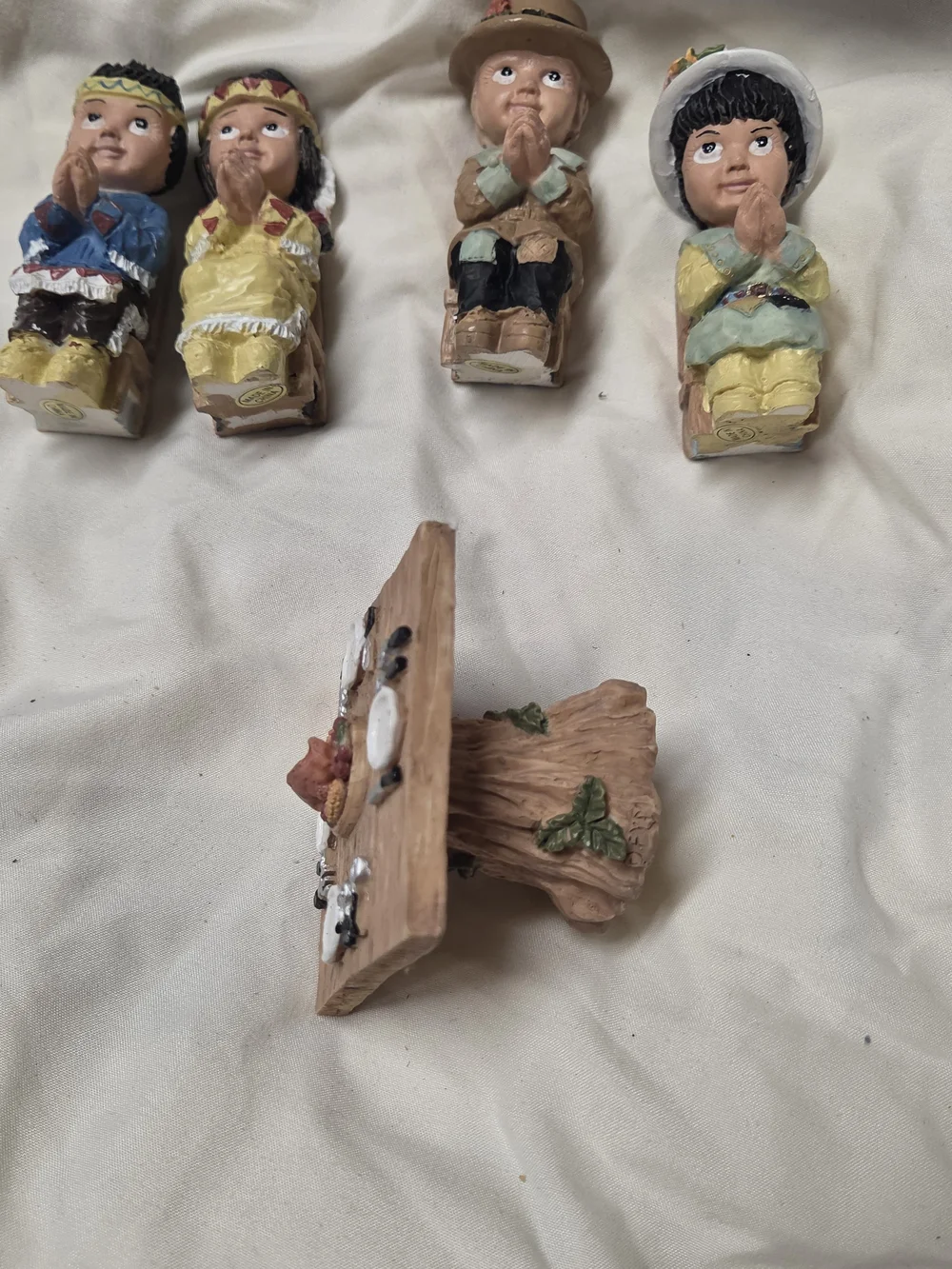 vintage miniature Thanksgiving figurines depicting praying Pilgrim And Native